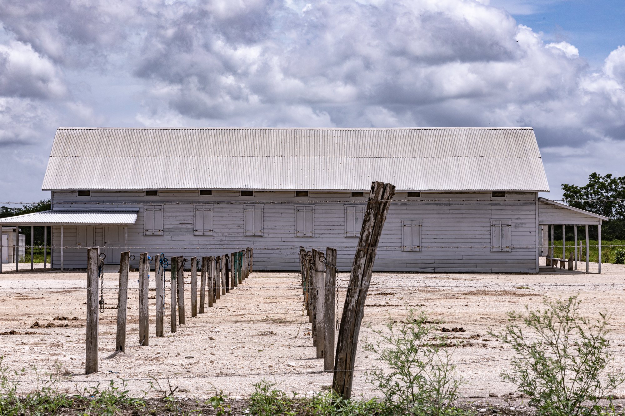 The long barn against an open sky
