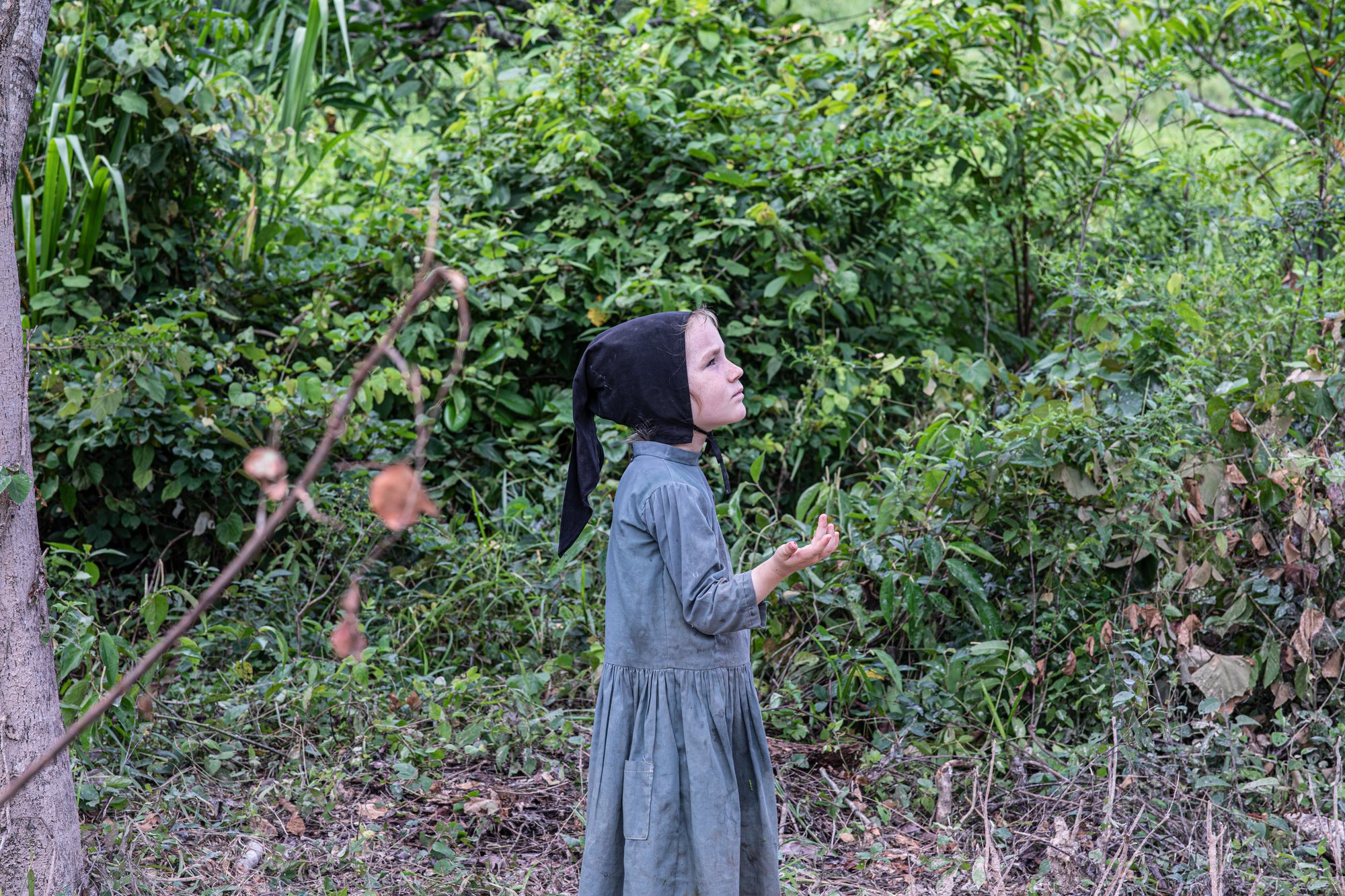 A girl in her bonnet, looking up