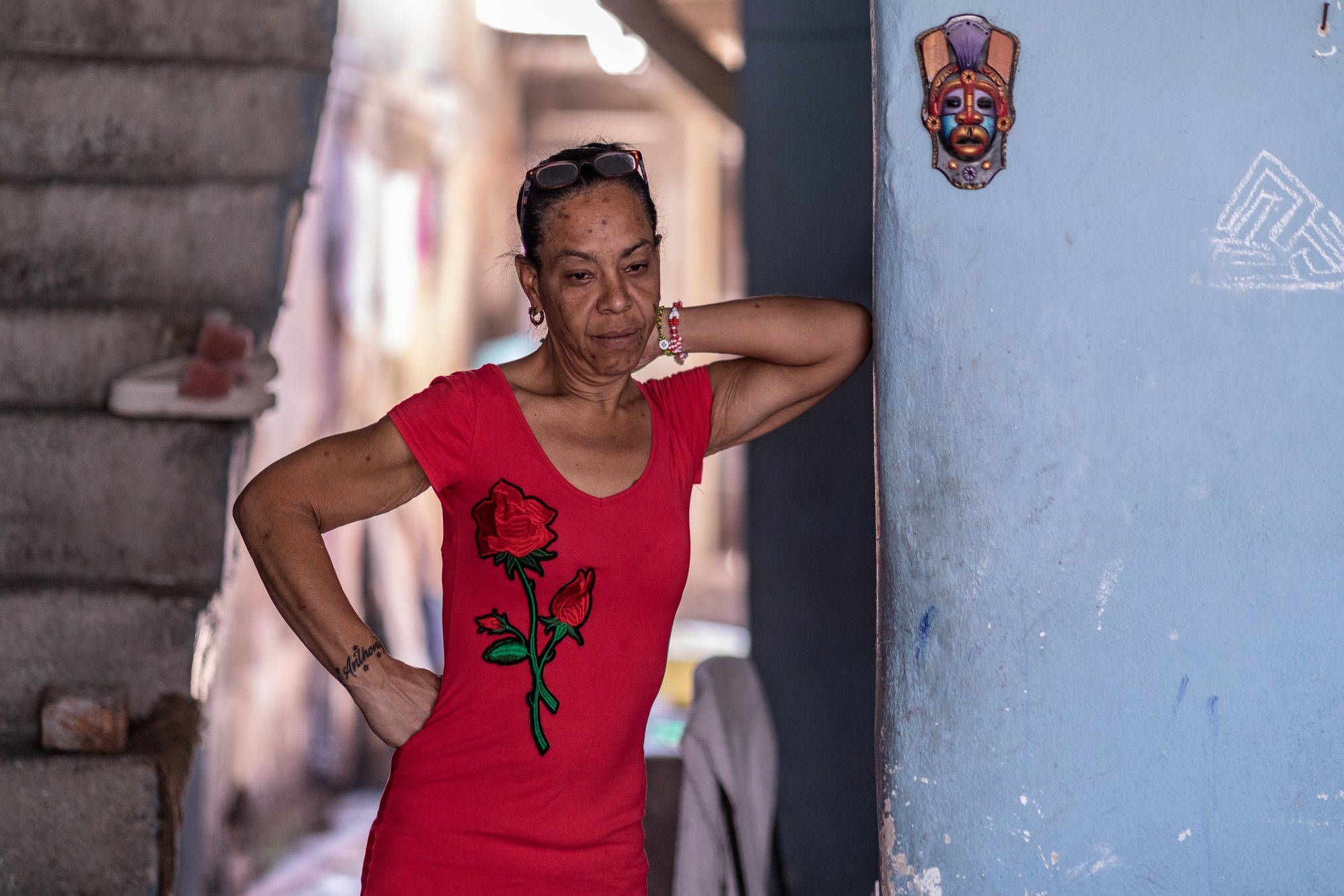 A female babalao at rest in the quiet afternoon light of her ilé